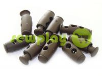 Fixator for cord d = 4mm plastic two-hole 9mm * 21mm brown, 10 pcs sku 614