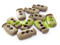 Fixator for cord d = 4mm plastic two-hole 12mm * 23mm brown, 10 pcs sku 619