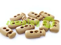 Fixator for cord d = 4mm plastic two-hole 12mm * 23mm beige, 10 pcs